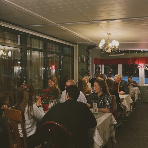 The team at a Christmas dinner in a restaurant