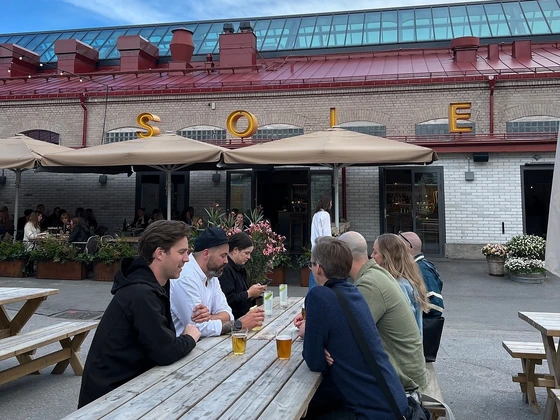 Colleagues at an outdoor table at Solen in Stockholm
